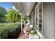 Cozy porch with wicker furniture and hanging ferns, perfect for relaxing outdoors at 12162 Mountain Laurel Dr, Roswell, GA 30075