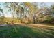 Expansive backyard with mature trees offering privacy and a park-like setting at 1496 S Hairston Rd, Stone Mountain, GA 30088