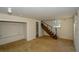 Unfinished basement with stairs and a window at 1496 S Hairston Rd, Stone Mountain, GA 30088