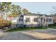 Charming home with a well-maintained lawn and mature trees at 1496 S Hairston Rd, Stone Mountain, GA 30088