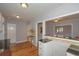 Well-lit kitchen with modern fixtures and hardwood flooring throughout at 1496 S Hairston Rd, Stone Mountain, GA 30088