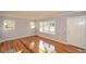 Inviting living room boasts hardwood floors and plenty of natural light at 1496 S Hairston Rd, Stone Mountain, GA 30088