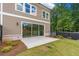 Backyard featuring a concrete patio perfect for outdoor entertaining with lawn and privacy fence at 206 Grady Burrell Dr, Holly Springs, GA 30115