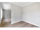 Bedroom with carpet, base trim, and neutral paint; entryway to another room is pictured at 206 Grady Burrell Dr, Holly Springs, GA 30115