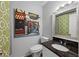 This bathroom has a decorative mirror, granite countertop, and a artistic piece of wall art at 3371 Spring Harbour Dr, Atlanta, GA 30340