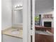 Well-lit bathroom with a granite countertop vanity and a decorative mirror and lighting fixture at 3371 Spring Harbour Dr, Atlanta, GA 30340