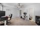 Bedroom setup as office features multiple computer monitors, neutral walls, and carpeting at 3371 Spring Harbour Dr, Atlanta, GA 30340