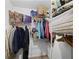 Walk-in closet with metal racks and rods and various items for storage at 3371 Spring Harbour Dr, Atlanta, GA 30340