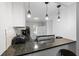 Sleek kitchen with granite countertops, modern fixtures, and ample counter space for culinary creations and bar seating at 3371 Spring Harbour Dr, Atlanta, GA 30340