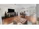 Spacious living room with hardwood floors, a view into the kitchen, and plenty of natural light at 3371 Spring Harbour Dr, Atlanta, GA 30340