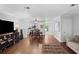 Open-concept living room and dining area with hardwood floors, plenty of space for entertaining, and natural light at 3371 Spring Harbour Dr, Atlanta, GA 30340