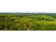 Lush treetop aerial view, offering privacy and serenity, with a distant city skyline at 398 Baker Nw Cir, Atlanta, GA 30318