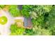 Aerial view of a home nestled in lush, green trees on a corner lot at 398 Baker Nw Cir, Atlanta, GA 30318