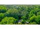 Aerial view of home surrounded by lush, mature trees at 398 Baker Nw Cir, Atlanta, GA 30318