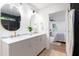 Bathroom featuring double sinks, white cabinetry and a step-in shower at 398 Baker Nw Cir, Atlanta, GA 30318