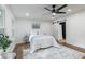 Comfortable bedroom featuring a ceiling fan, hardwood floors and access to the bathroom at 398 Baker Nw Cir, Atlanta, GA 30318