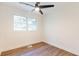 This bedroom has wood look floors, natural light and a modern ceiling fan at 398 Baker Nw Cir, Atlanta, GA 30318