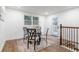 Bright dining area with table, chairs, natural light, and staircase access at 398 Baker Nw Cir, Atlanta, GA 30318