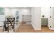 Cozy dining area featuring table with chairs and access to staircase and small dry bar at 398 Baker Nw Cir, Atlanta, GA 30318