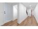 Hallway featuring hardwood floors and bright white walls at 398 Baker Nw Cir, Atlanta, GA 30318