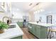 Contemporary kitchen featuring stainless steel appliances, bright countertops and island with seating at 398 Baker Nw Cir, Atlanta, GA 30318