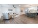 Open concept living room and kitchen with hardwood floors, neutral paint, modern lighting, and plenty of space to entertain at 398 Baker Nw Cir, Atlanta, GA 30318