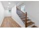 Hallway featuring an ornate stairway and hardwood floors at 398 Baker Nw Cir, Atlanta, GA 30318