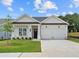 Charming single-story home with a well-manicured lawn, two-car garage and inviting front porch at 404 Vinca Nw Cir, Kennesaw, GA 30144
