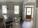 Inviting dining room with natural wood table, wood floors, and great natural light at 605 Red Leaf Way, Canton, GA 30114