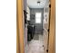 Clean laundry room features modern washer and dryer set with gray tile flooring and natural light at 605 Red Leaf Way, Canton, GA 30114