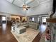 Spacious living room with vaulted ceiling, stone fireplace, and view into kitchen area at 605 Red Leaf Way, Canton, GA 30114