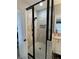 Walk-in shower with glass enclosure, tiled walls, and rainfall shower head at 605 Red Leaf Way, Canton, GA 30114
