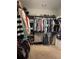 Walk-in closet with hanging racks, shelving, and ample storage space for clothes and shoes at 605 Red Leaf Way, Canton, GA 30114