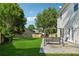 A well maintained backyard featuring a swing and lots of green space at 1093 Forest View Sw Ln, Lilburn, GA 30047