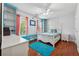 Bright bedroom featuring hardwood floors, built-in shelves, and a large window seat at 1093 Forest View Sw Ln, Lilburn, GA 30047