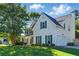 Inviting residence boasting a two-car garage, manicured lawn, and classic curb appeal at 1093 Forest View Sw Ln, Lilburn, GA 30047