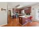 Well-equipped kitchen with custom cabinetry, sleek appliances, and a convenient breakfast bar at 1093 Forest View Sw Ln, Lilburn, GA 30047