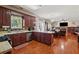 Functional kitchen featuring ample counter space, a breakfast bar, and views into living area at 1093 Forest View Sw Ln, Lilburn, GA 30047