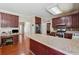 Open Kitchen with ample counter space, full appliances, and hardwood flooring at 1093 Forest View Sw Ln, Lilburn, GA 30047