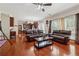 Open concept living area with hardwood floors, connecting dining and living spaces at 1093 Forest View Sw Ln, Lilburn, GA 30047