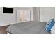 Bedroom features hardwood floors and a view to the ensuite bathroom at 118 Via Roma, Woodstock, GA 30188