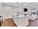 Kitchen island with stainless steel appliances and an open floor plan at 118 Via Roma, Woodstock, GA 30188