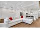 Open-concept living room and kitchen with a coffered ceiling and large windows at 118 Via Roma, Woodstock, GA 30188