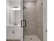 Tiled stand up shower with white vanity and grey shower tiles at 118 Via Roma, Woodstock, GA 30188