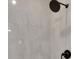 Close-up of modern shower with sleek fixtures and light gray wall tiles at 118 Via Roma, Woodstock, GA 30188