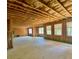 Unfinished basement featuring exposed beams, insulation, and multiple windows at 211 Serendipity Way, Dallas, GA 30157