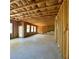 Spacious unfinished basement with framing, windows, and a doorway leading to the outdoors at 211 Serendipity Way, Dallas, GA 30157