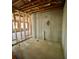 Unfinished basement with concrete walls, exposed beams, and wooden framing for future construction at 211 Serendipity Way, Dallas, GA 30157