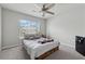 Bedroom featuring a ceiling fan and natural light from the window at 211 Serendipity Way, Dallas, GA 30157