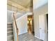 Open foyer featuring hardwood floors, staircase with white railings, and view of the upstairs landing at 211 Serendipity Way, Dallas, GA 30157